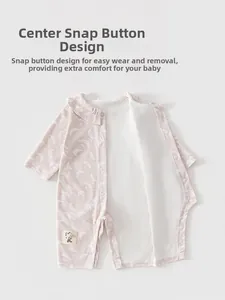 Detailed snaps and moon star print on soft pink baby romper with rabbit patch