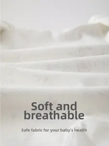 Close-up of soft cotton baby floral fabric showing breathable texture and fine fibers