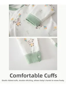 Detail of baby cotton pajama cuffs with mint green ribbing and cute panda patterns