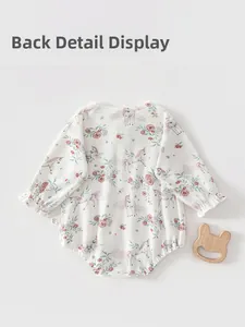Detailed back view of baby bodysuit with pink rose and unicorn prints in soft cotton