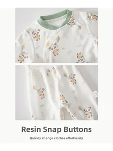 Detail of baby cotton pajama set showing panda print and resin snaps on inner lining