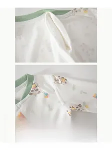 Detail of boneless stitching on baby cotton suit with panda and kite prints