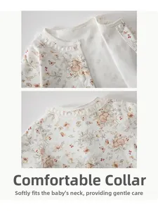 Detailed view of baby romper featuring lace collar and delicate floral bunny print