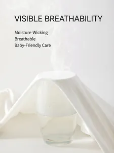 Breathable white ribbed cotton infant jumpsuit showing steam ventilation test