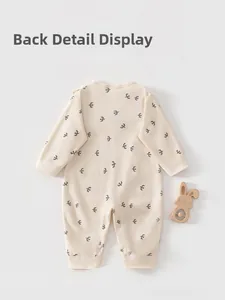 Back view of long-sleeve baby cotton romper featuring dark grey flying bird patterns