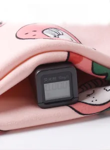 Close-up of baby romper fabric showing 0.00 fluorescent test result for safety
