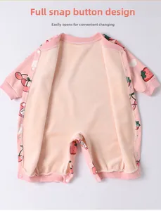 Detail view of pink baby romper with cherry print and convenient front snap buttons