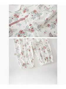 Detail of baby romper featuring floral unicorn prints and elastic ruffled cuffs on soft cotton