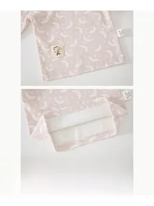 Detail of baby pink cotton pajama set with floral moon print and durable double stitching