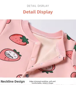 Close-up of pink baby bodysuit with strawberry prints and soft fleece inner lining