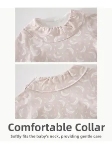 Detail of baby girl cotton pajama neckline with ruffle edges and moon pattern print