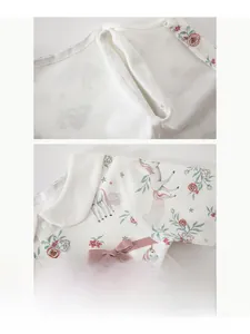Detail of flatlock seams and unicorn floral print on soft cotton baby romper