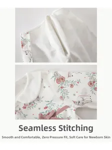 Detail of baby cotton top with Peter Pan collar, pink floral print and flat seam sewing