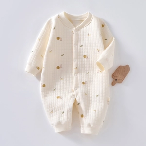 Quilted cotton baby romper in cream with snail prints and ribbed cuffs for winter warmth