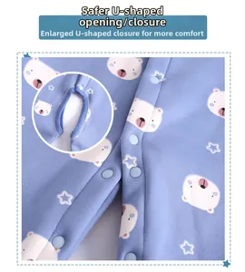 Detail of U-shaped snap closure on blue thick fleece baby romper with bear and star patterns