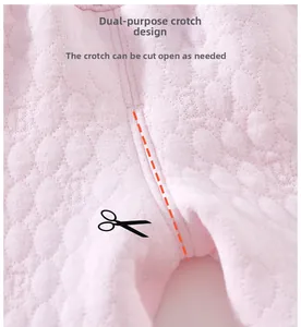Close-up of pink quilted baby pants featuring a cuttable crotch design for convenience