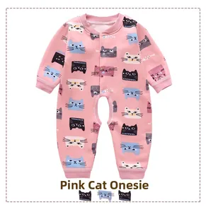 Close-up of pink baby romper featuring cartoon cat prints and ribbed cuffs