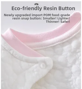 Detail of the baby thermal wear collar featuring a pink trim and a safe POM resin snap button