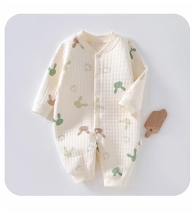 Close-up of baby quilted romper with bunny ice cream prints and rib-knit cuffs