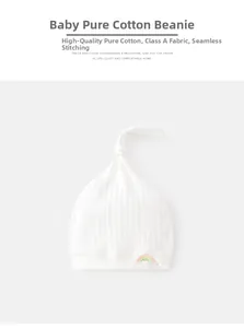 Detail of baby cotton cap featuring seamless bone-free stitching and rainbow embroidery