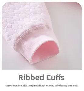 Close-up of pink quilted fabric and ribbed cuffs for warm baby winter thermal pants