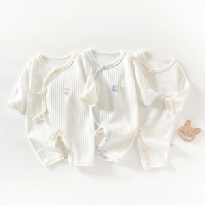 Three-piece baby cotton ribbed rompers in white with yellow blue and pink trims