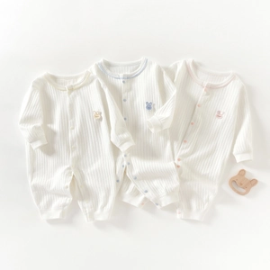 Cotton ribbed long sleeve baby rompers in cream white with colorful embroidery on white background