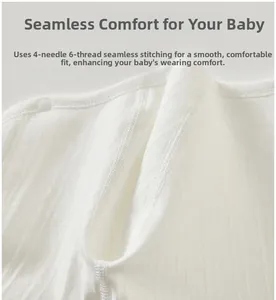Close-up of four-needle six-thread seamless stitching on white ribbed cotton baby romper