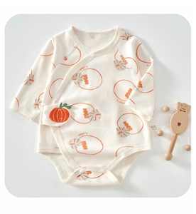 Detail of baby long sleeve cotton bodysuit with Lotus print and pumpkin embroidery