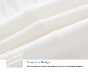 Macro detail of seamless boneless stitching on white soft cotton baby beanie fabric