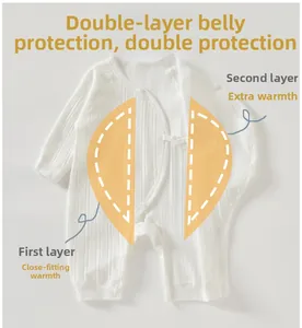 Detail view of cotton newborn romper with double-layer belly protection and side snaps