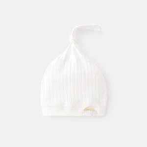 Soft white ribbed cotton newborn baby beanie with cute rainbow embroidery and top knot