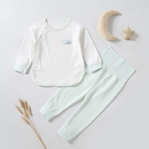 Infant cotton pajama set with white long sleeve top and green high waist thermal pants