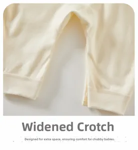 Detail of baby cotton jumpsuit featuring a widened crotch and invisible snap buttons