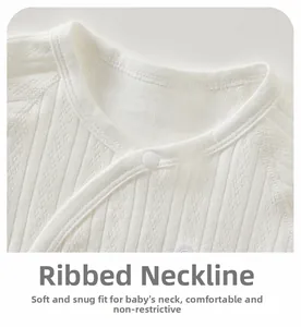 Detailed view of white cotton newborn bodysuit with V-neck and breathable hollow knit texture