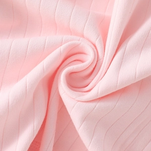 Light pink ribbed cotton fabric close-up for newborn bodysuit with soft texture