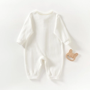 Warm white long-sleeve ribbed baby romper jumpsuit with wooden bunny teether accessory