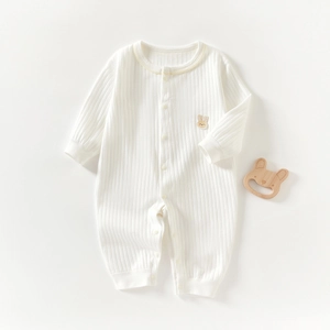 Long sleeve white ribbed knit baby romper with cute rabbit patch and wood teether prop
