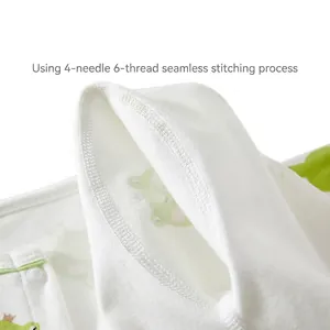 Newborn baby white cotton romper with green frog pattern and smooth flatlock stitching