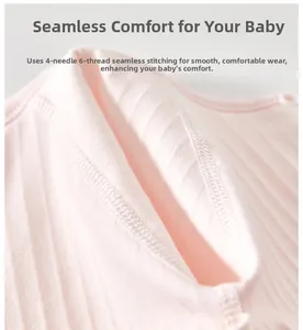 Detailed macro view of pink cotton baby onesie featuring smooth seamless stitching process