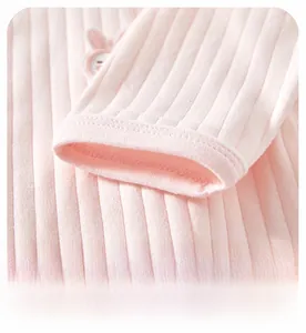 Close-up of baby pink cotton rib-knit sleeves with professional hemmed cuff detailing