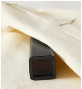 Close-up of safety tester showing zero formaldehyde on soft cotton baby underwear fabric