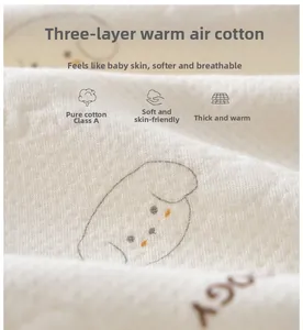 Macro detail of breathable quilted cotton fabric with cute dog print for baby rompers