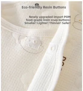 Detail of infant jumpsuit featuring food-grade POM resin snaps on quilted cotton fabric
