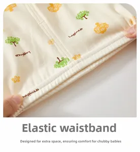 Close-up of elastic waistband on infant cotton pants with tree print and high elasticity