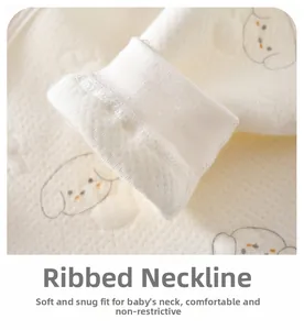 Detail of soft ribbed neckline with cute puppy print on organic cotton baby romper