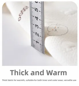 Macro shot of thick quilted thermal fabric for baby romper showing 2cm thickness