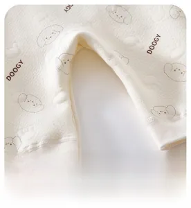 Detail of baby romper featuring breathable honeycomb cotton fabric and wide crotch design