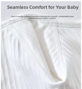 Close-up of four-needle six-thread seamless stitching on white ribbed baby bodysuit