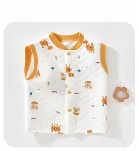 Detail view of quilted baby vest featuring yellow trim and cute cartoon animal prints